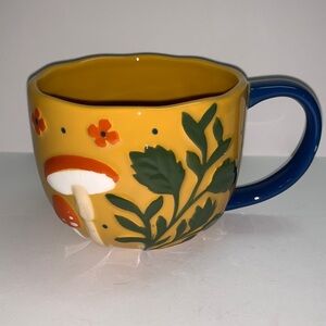 Handcrafted Yellow Mug with Mushroom Design